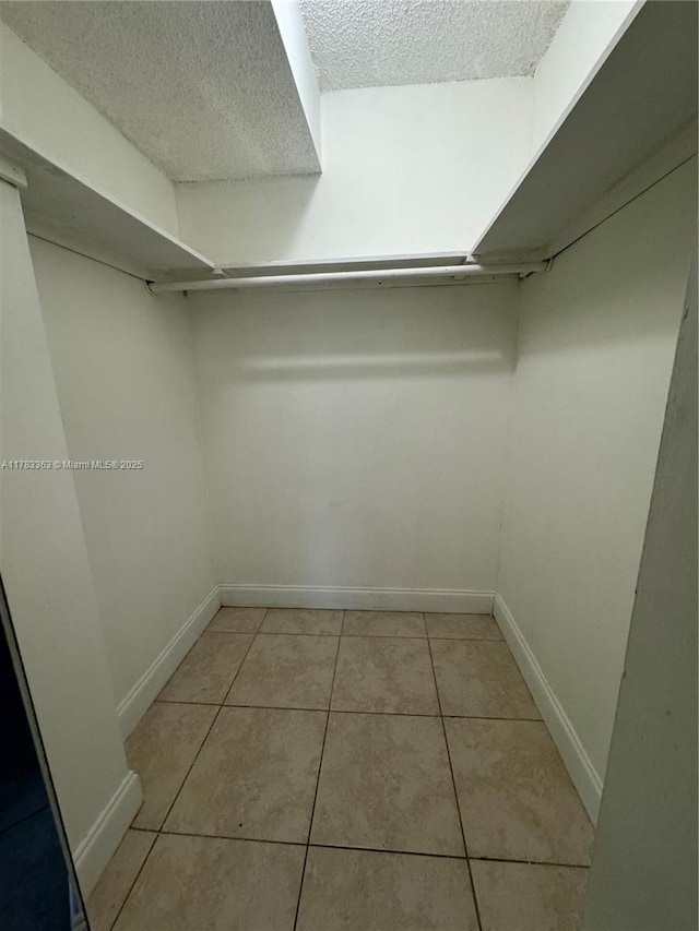 16465 NE 22nd Ave Unit 205, North Miami Beach, FL 33160 - spacious closet with light tile patterned floors