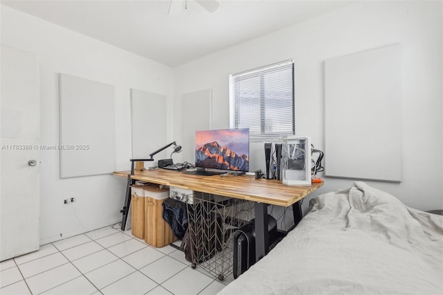 bedroom with ceiling fan and light tile patterned flooring