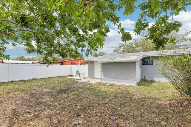 view of yard featuring a patio area and fence