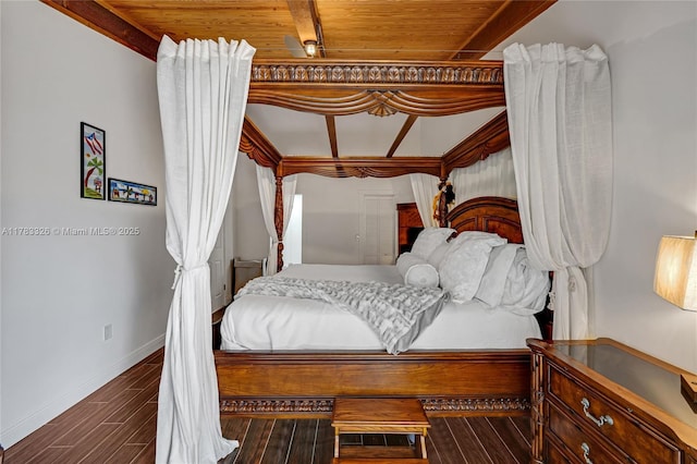 bedroom with wood ceiling, wood finished floors, and baseboards