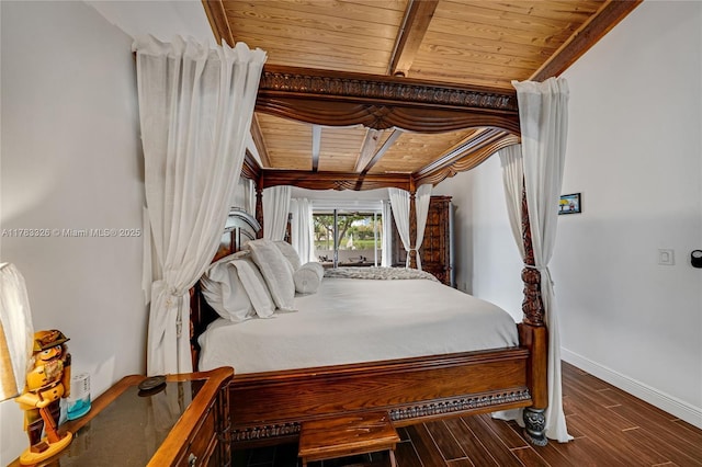 bedroom featuring baseboards, wooden ceiling, and wood finished floors