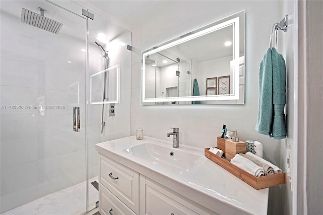 full bathroom with vanity and a stall shower