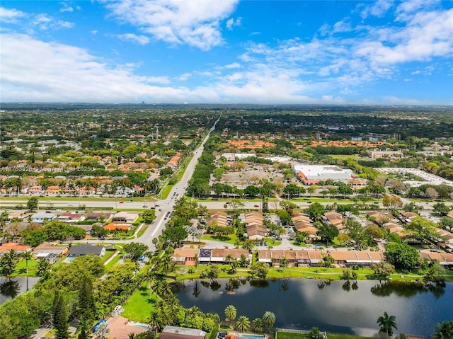 drone / aerial view featuring a residential view and a water view