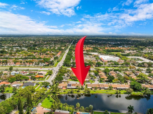 birds eye view of property with a water view and a residential view