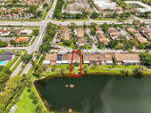 birds eye view of property featuring a water view and a residential view