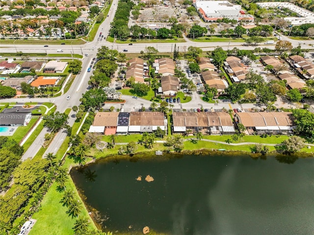 bird's eye view featuring a water view and a residential view