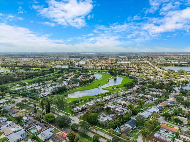 drone / aerial view with a water view and a residential view