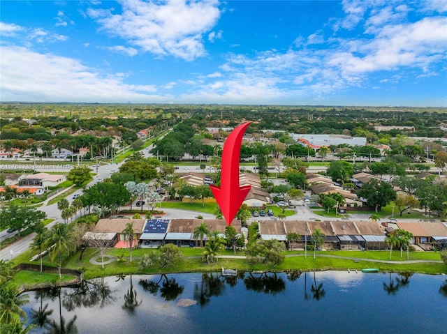 drone / aerial view with a water view and a residential view