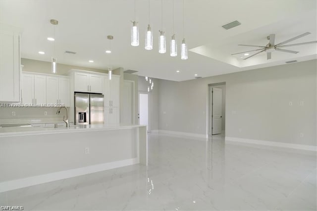 3308 SW 17th St, Lehigh Acres, FL 33971 - kitchen featuring open floor plan, baseboards, visible vents, marble finish floor, and stainless steel refrigerator with ice dispenser