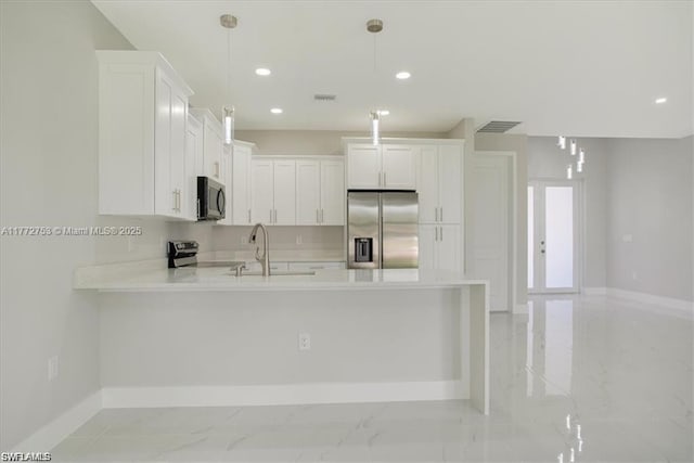 3308 SW 17th St, Lehigh Acres, FL 33971 - kitchen with visible vents, a sink, light countertops, appliances with stainless steel finishes, and marble finish floor