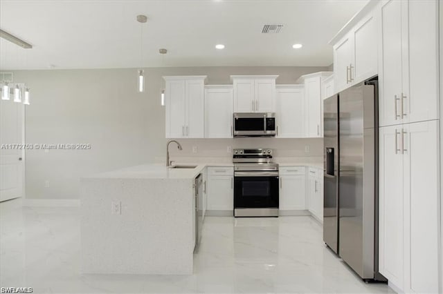 3308 SW 17th St, Lehigh Acres, FL 33971 - kitchen with a peninsula, visible vents, marble finish floor, a sink, and stainless steel appliances
