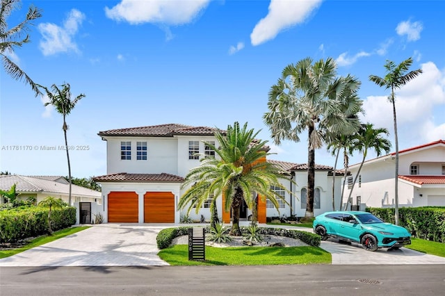 3408 NE 169th St, North Miami Beach, FL 33160 - mediterranean / spanish-style home featuring a garage, driveway, a tiled roof, and stucco siding