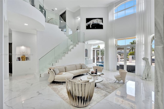 3408 NE 169th St, North Miami Beach, FL 33160 - living room featuring a high ceiling, marble finish floor, and stairway