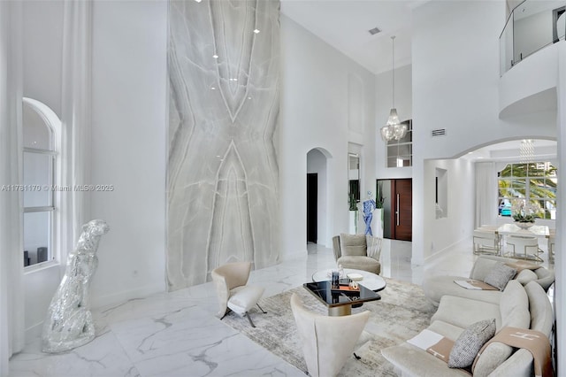 3408 NE 169th St, North Miami Beach, FL 33160 - living room with arched walkways, a high ceiling, and marble finish floor
