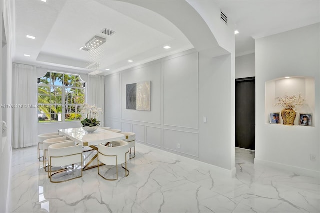 3408 NE 169th St, North Miami Beach, FL 33160 - dining area with a raised ceiling, a decorative wall, marble finish floor, and visible vents