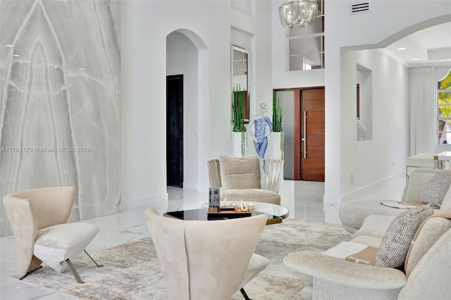 3408 NE 169th St, North Miami Beach, FL 33160 - interior space featuring visible vents, baseboards, arched walkways, and marble finish floor
