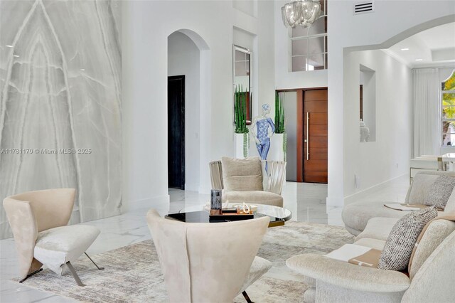 3408 NE 169th St, North Miami Beach, FL 33160 - interior space featuring visible vents, baseboards, arched walkways, and marble finish floor