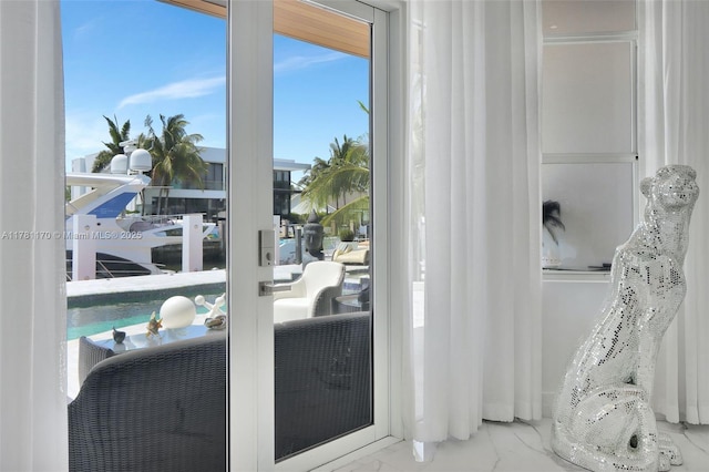 3408 NE 169th St, North Miami Beach, FL 33160 - doorway to outside with marble finish floor and plenty of natural light