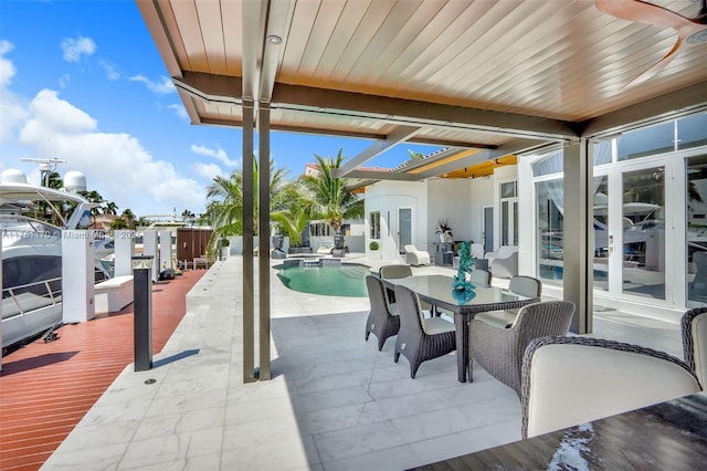3408 NE 169th St, North Miami Beach, FL 33160 - view of patio featuring outdoor dining space and a fenced in pool