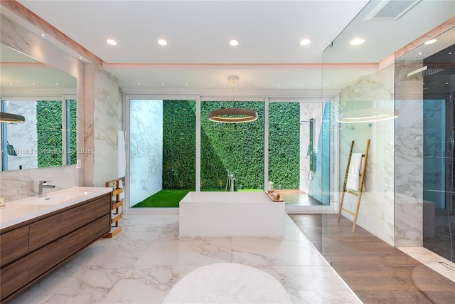 6295 SW 126th St, Pinecrest, FL 33156 - full bathroom featuring a freestanding tub, vanity, recessed lighting, marble tiled floors, and a shower with door