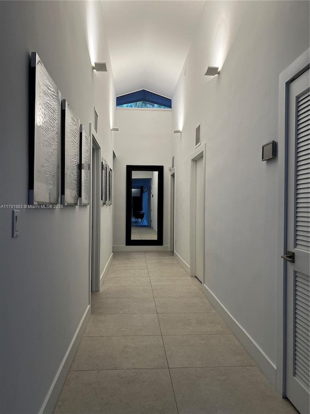 6295 SW 126th St, Pinecrest, FL 33156 - hallway featuring vaulted ceiling, tile patterned floors, and baseboards
