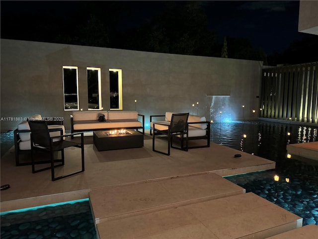 6295 SW 126th St, Pinecrest, FL 33156 - patio at twilight with an outdoor fire pit and a pool
