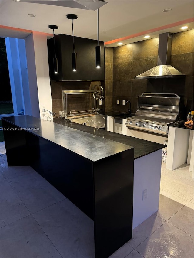 6295 SW 126th St, Pinecrest, FL 33156 - kitchen featuring wall chimney exhaust hood, stainless steel range with electric cooktop, dark countertops, tile patterned floors, and a sink