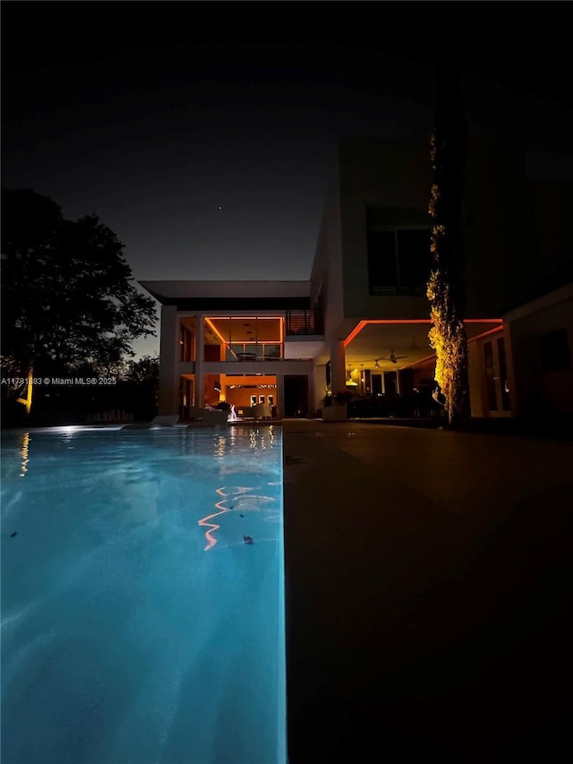 6295 SW 126th St, Pinecrest, FL 33156 - pool at twilight featuring an outdoor pool