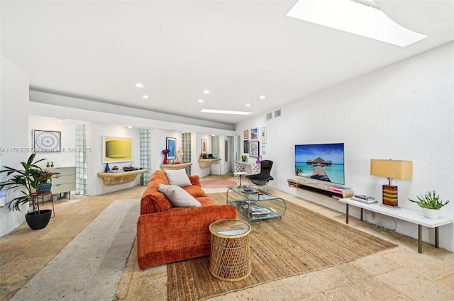 3200 Morris Ln, Miami, FL 33133 - living room with stone tile flooring, a skylight, visible vents, and recessed lighting