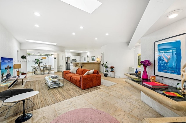 3200 Morris Ln, Miami, FL 33133 - living area featuring a skylight, stone tile flooring, and recessed lighting