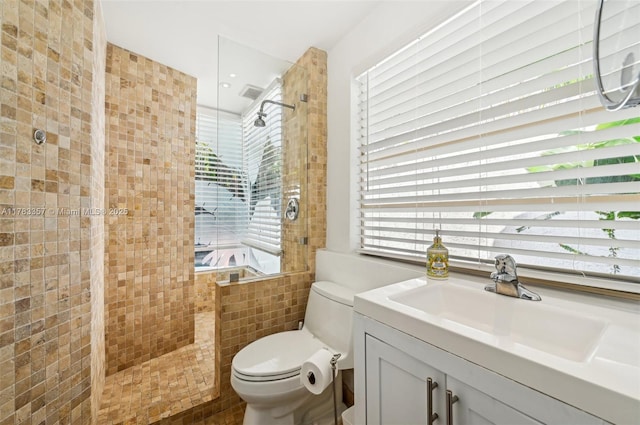 3200 Morris Ln, Miami, FL 33133 - bathroom featuring a tile shower, vanity, and toilet
