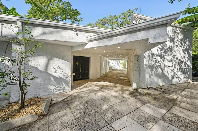 3200 Morris Ln, Miami, FL 33133 - entrance to property featuring a patio and stucco siding