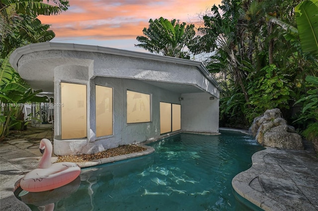 3200 Morris Ln, Miami, FL 33133 - pool at dusk with an outdoor pool