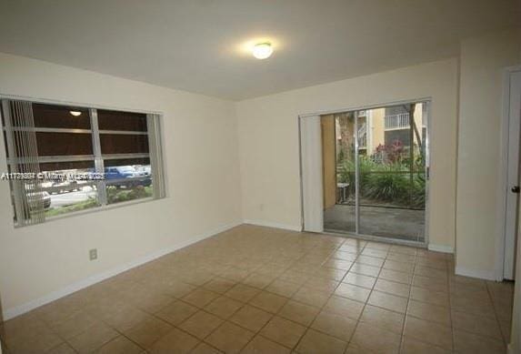15300 SW 106th Ter Unit 534, Miami, FL 33196 - unfurnished room with baseboards and tile patterned flooring