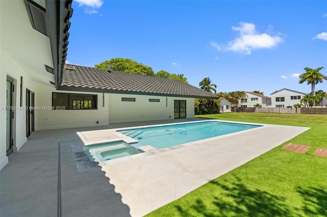 view of pool featuring a yard, an in ground hot tub, a patio area, and a fenced in pool