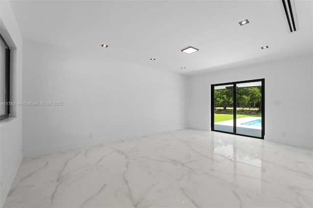 empty room featuring marble finish floor, recessed lighting, and visible vents