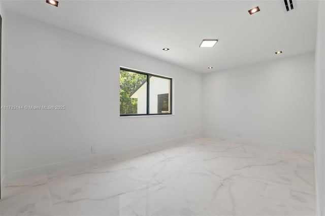 unfurnished room featuring visible vents, marble finish floor, baseboards, and recessed lighting