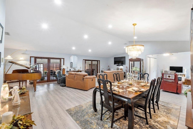18201 SW 87th Ave, Palmetto Bay, FL 33157 - dining area featuring french doors, light wood-style flooring, vaulted ceiling, and a chandelier