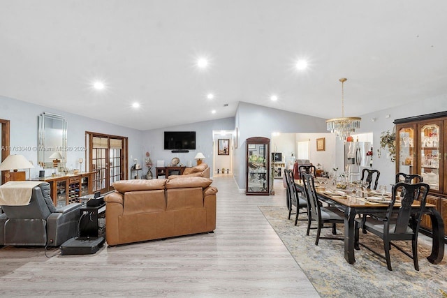 18201 SW 87th Ave, Palmetto Bay, FL 33157 - living room with vaulted ceiling, light wood finished floors, a chandelier, recessed lighting, and french doors