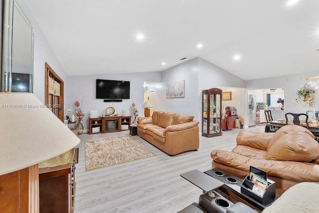 18201 SW 87th Ave, Palmetto Bay, FL 33157 - living room with lofted ceiling, wood finished floors, and recessed lighting