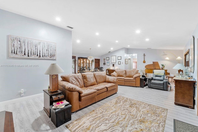 18201 SW 87th Ave, Palmetto Bay, FL 33157 - living area with light wood finished floors, recessed lighting, lofted ceiling, and baseboards