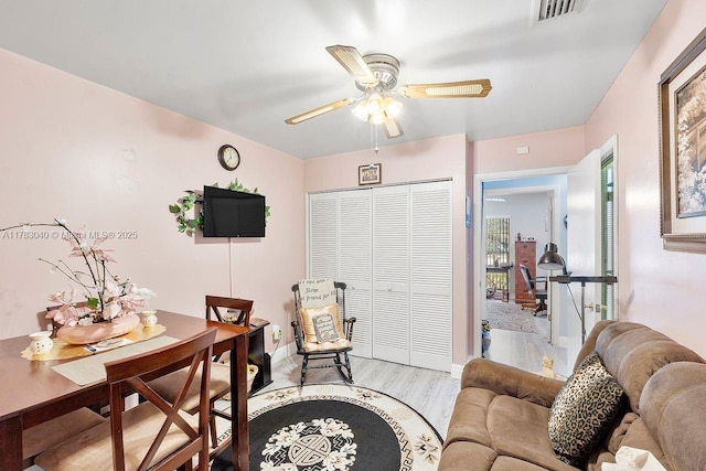 18201 SW 87th Ave, Palmetto Bay, FL 33157 - living area with light wood-style flooring, ceiling fan, and baseboards