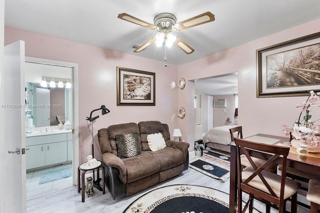 18201 SW 87th Ave, Palmetto Bay, FL 33157 - living room featuring ceiling fan, light wood-style floors, and a wall mounted air conditioner