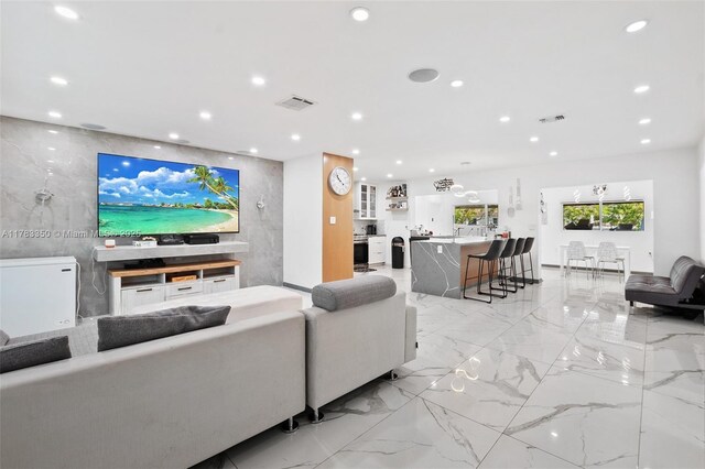 5117 Washington St, Hollywood, FL 33021 - living area with recessed lighting, visible vents, and marble finish floor