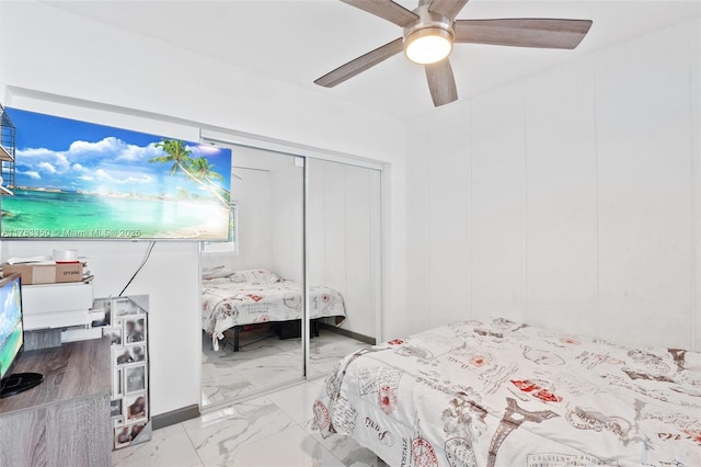 5117 Washington St, Hollywood, FL 33021 - bedroom featuring a closet, marble finish floor, and ceiling fan