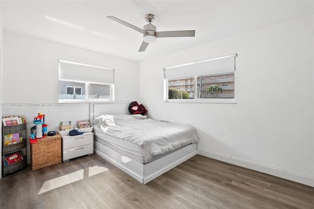 5117 Washington St, Hollywood, FL 33021 - bedroom featuring wood finished floors, ceiling fan, and baseboards