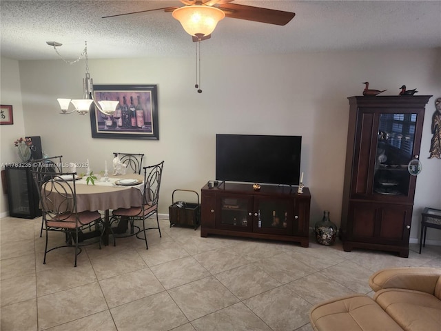 2114 E Cambridge E Unit 2114, Deerfield Beach, FL 33442 - dining space with tile patterned flooring, ceiling fan with notable chandelier, and baseboards