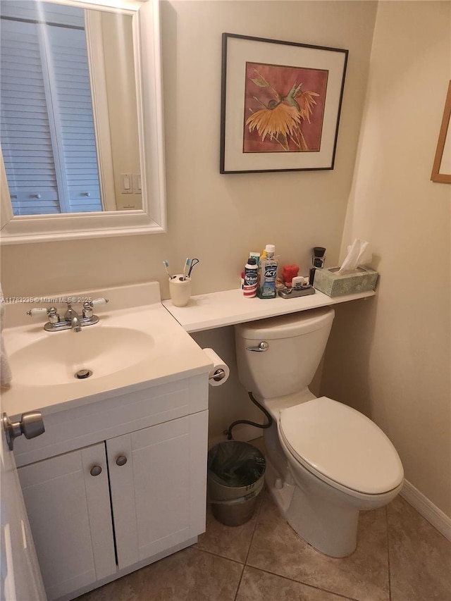 2114 E Cambridge E Unit 2114, Deerfield Beach, FL 33442 - bathroom with tile patterned flooring, vanity, baseboards, and toilet