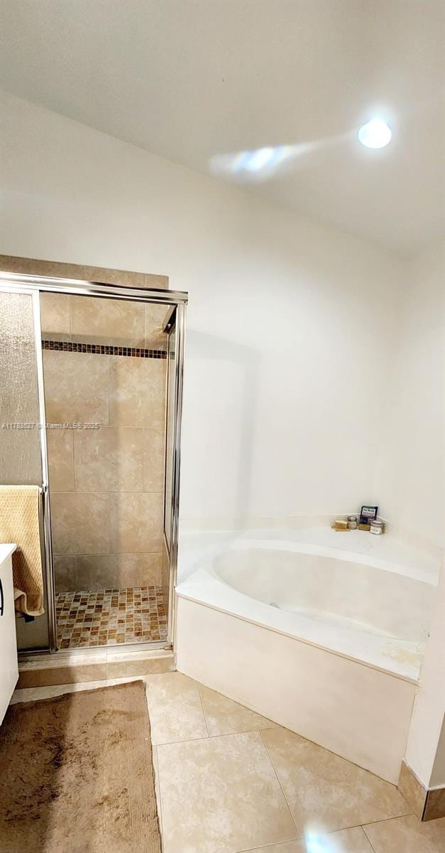 502 SW 158th Ter Unit 203, Pembroke Pines, FL 33027 - full bath with a bath, a shower stall, tile patterned floors, vanity, and recessed lighting