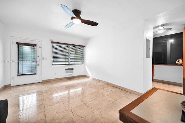 interior space featuring a healthy amount of sunlight, baseboards, and a ceiling fan